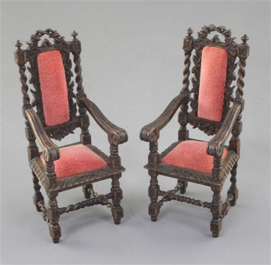 Denis Hillman. A pair of Victorian style Carolean design miniature oak elbow chairs, height 4in.